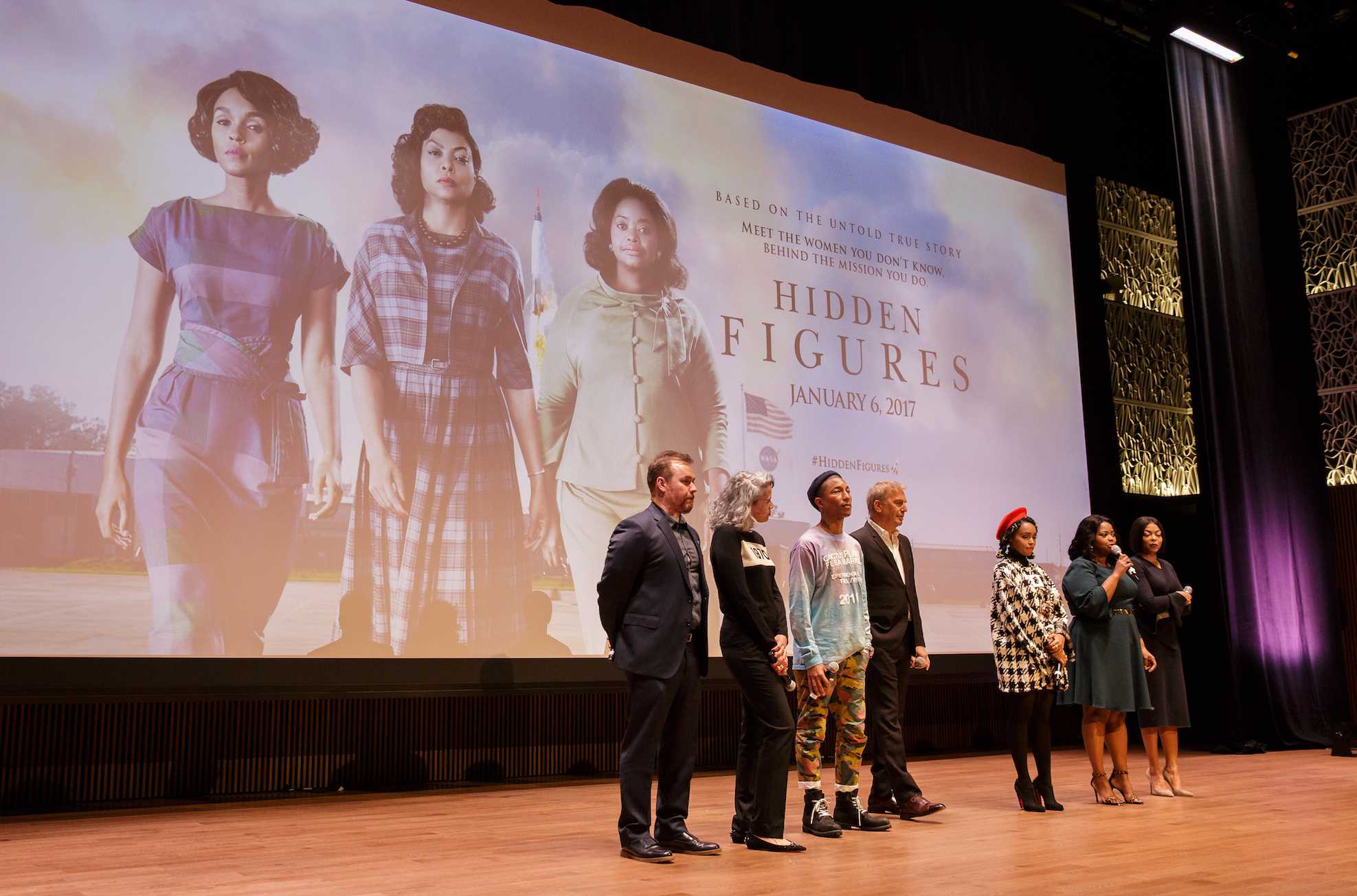 From left: director Theodore Melfi, producer Mimi Valdés, American singer-songwriter Pharrell Williams, American actor, film director, and producer Kevin Costner, American musical recording artist, actress, and model Janelle Monáe, American actress Octavia Spencer, and American actress and singer Taraji P. Henson, are seen on stage prior to a screening of the film “Hidden Figures” at the Smithsonian’s National Museum of African American History and Culture, Wednesday, Dec. 14, 2016 in Washington DC.