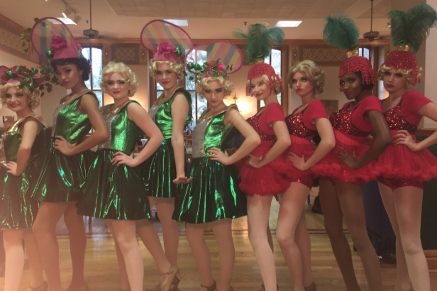 The “Follies” pose in their costumes for Crazy for You.
