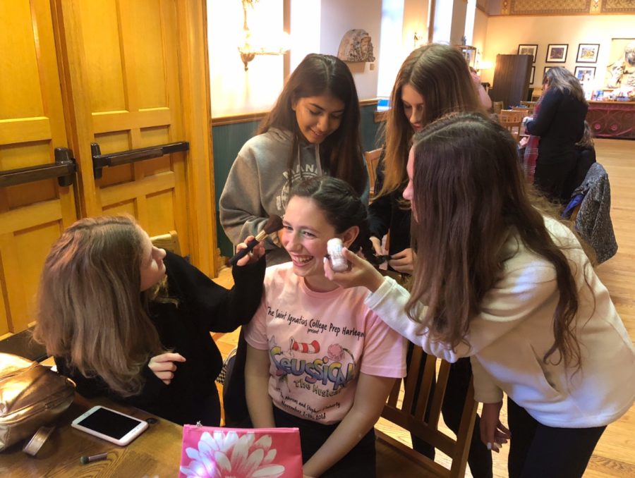 Makeup girls working their magic on Lily Dahlborn ‘22.
