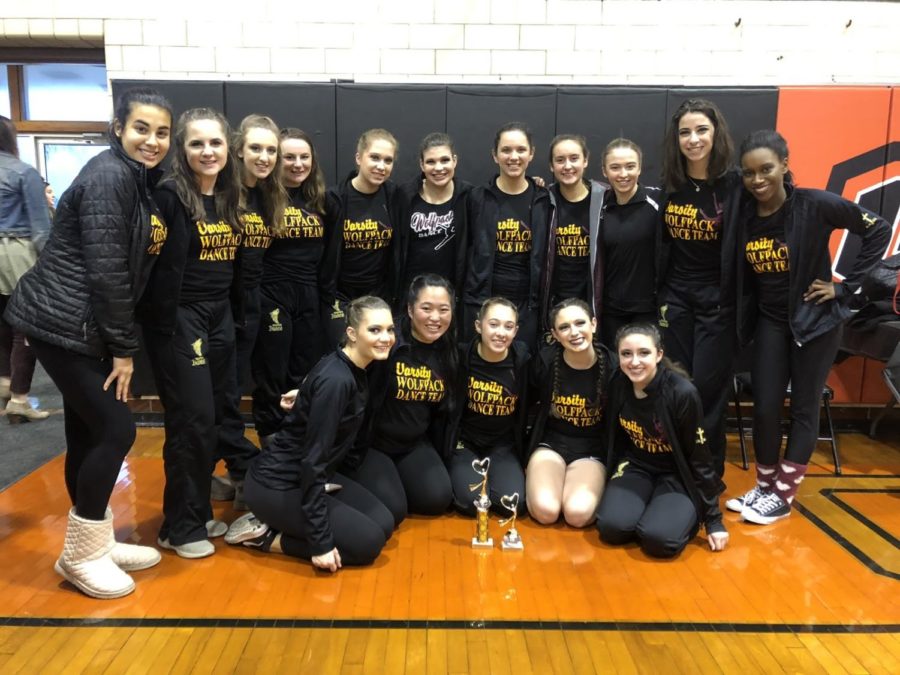 SICP Dance Team poses with their 1st and 4th place trophies after their performances at Glenbard-South High School on December 1st.