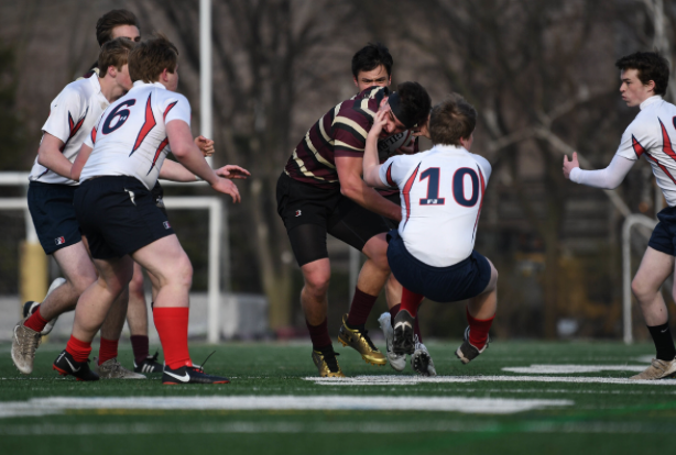 Senior Zach Allen running through a St. Rita defender. 